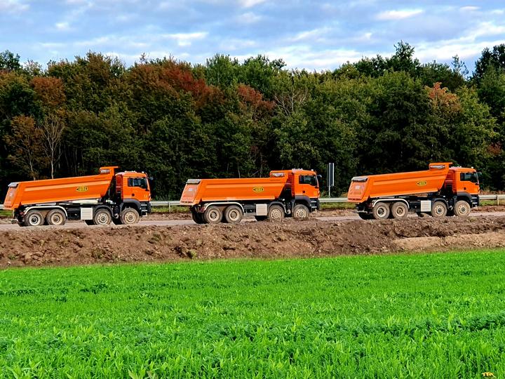 Three Construction trucks
