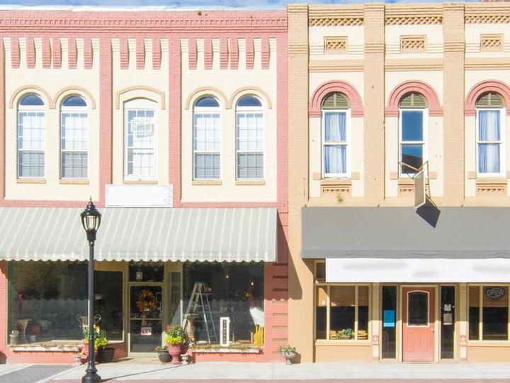 Store fronts lining a main street.