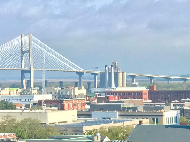 a big river with a bridge and a town