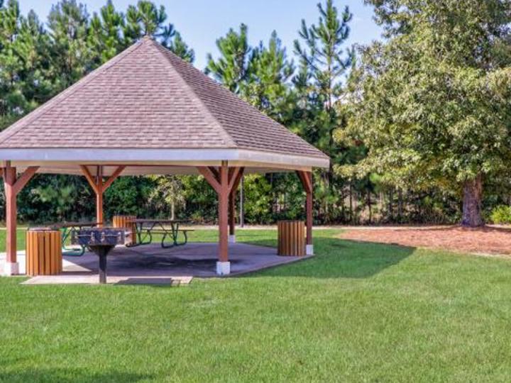 a nice gazebo in a well manicured lawn