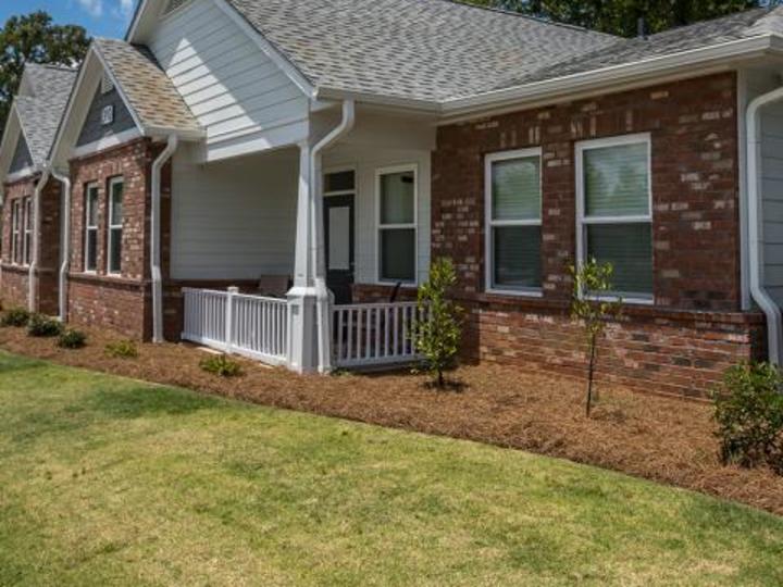 a home with new trees and grass