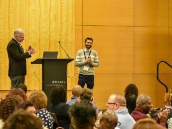 man talking at a podium