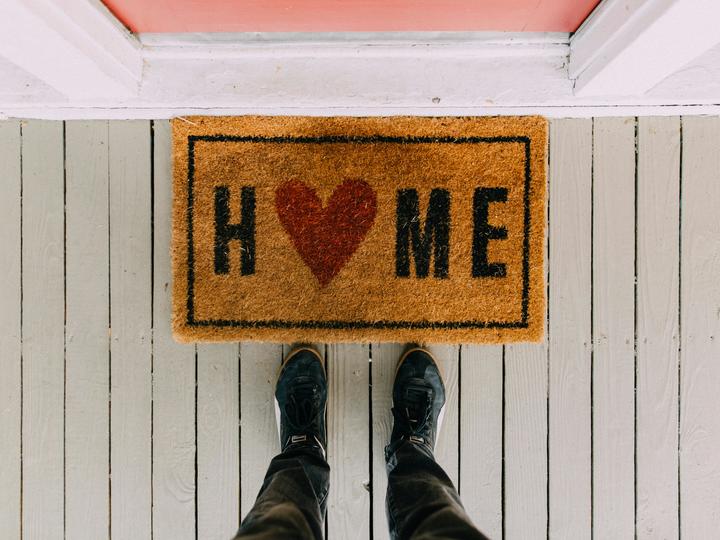 welcome mat that says HOME