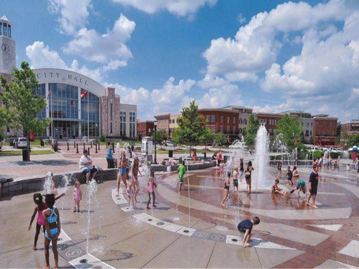 Kids playing at a water fountain park in downtown Suwanee, GA