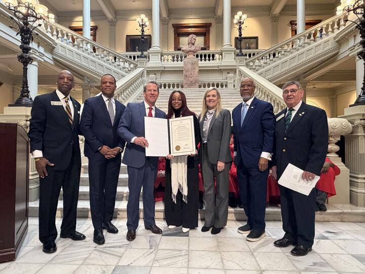 Governor Kemp giving an award