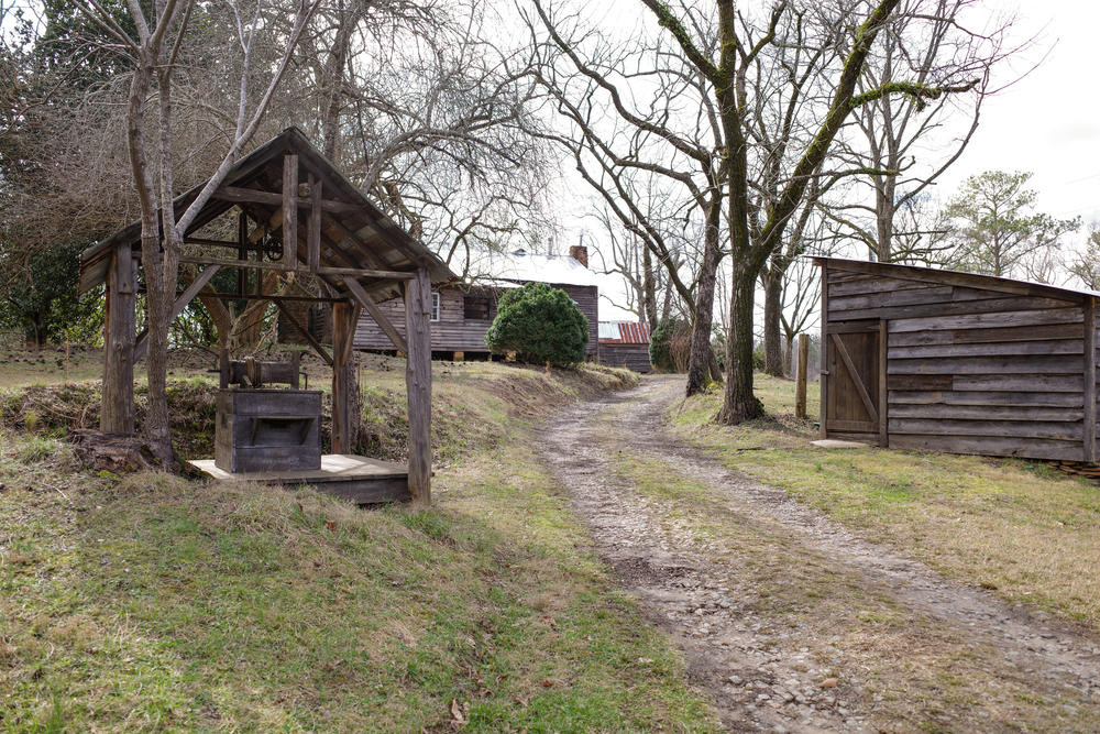 Power-Hyde Farm several wooden buildings along dirt road