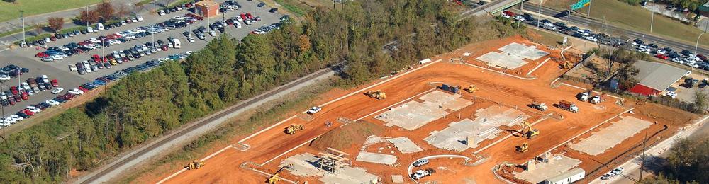 large construction site with a parking lot 