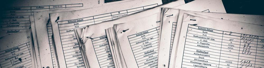 a lot of documents on a table