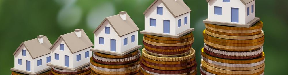 fake houses stacked on top of coins