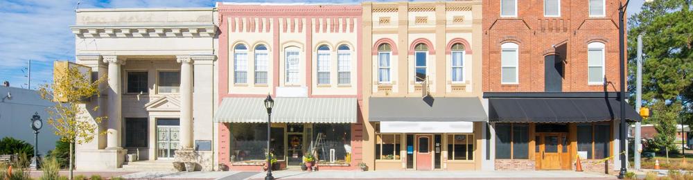 Store fronts lining a main street.